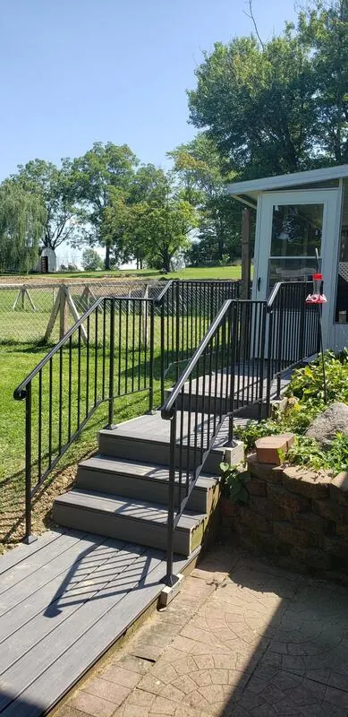 Custom metal handrail installation on backyard steps in Trenton, OH